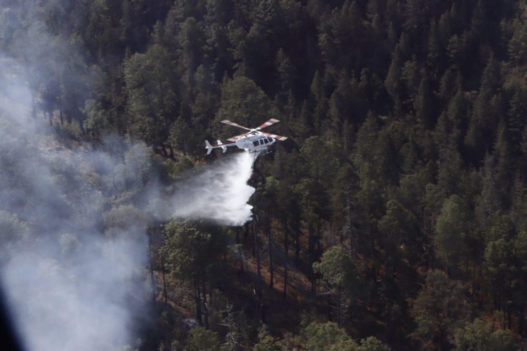 Mantienen tres órdenes de gobierno trabajos de liquidación de incendio de Libres